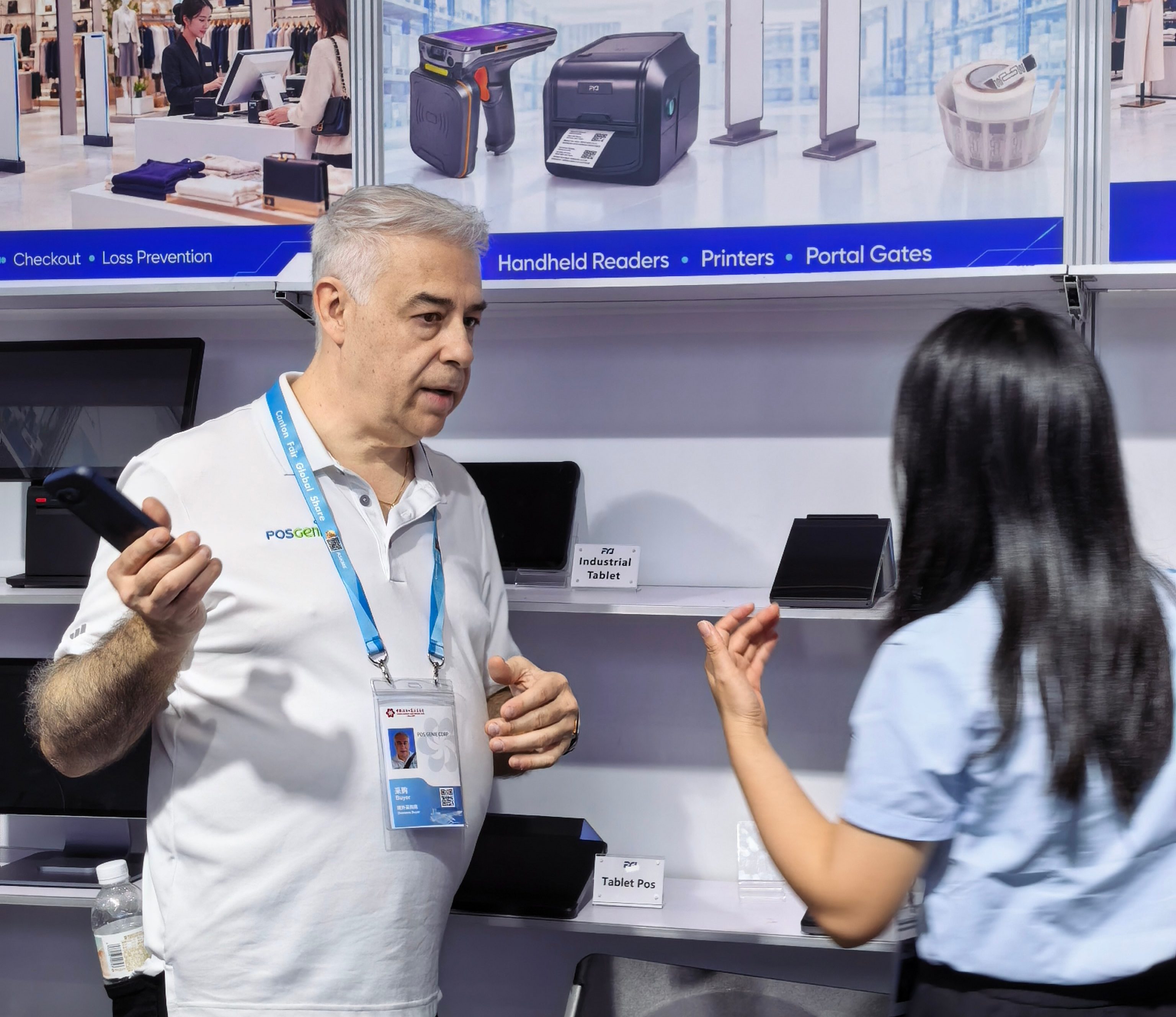 Customer exploring RFID checkout, inventory and retail management equipment at the FYJ booth